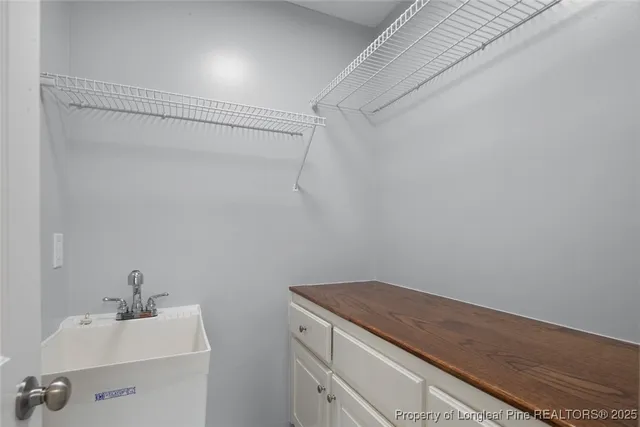 a bathroom with a sink and vanity