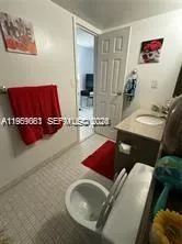 a living room with furniture and a mirror