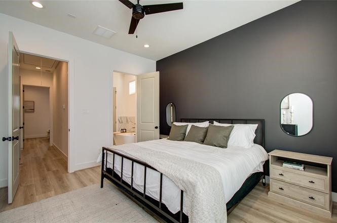 2309 Eagle Street Houston, TX 77004 - Photo 12 of 34 a bedroom with a bed and a dresser