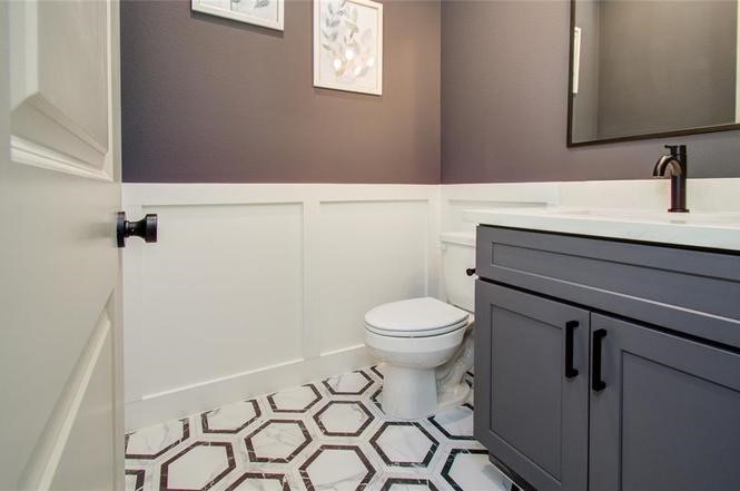 2309 Eagle Street Houston, TX 77004 - Photo 16 of 34 a bathroom with a toilet a sink and mirror