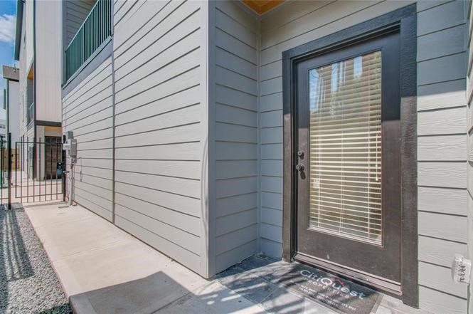 2309 Eagle Street Houston, TX 77004 - Photo 23 of 34 a view of a porch with a door and wooden floor