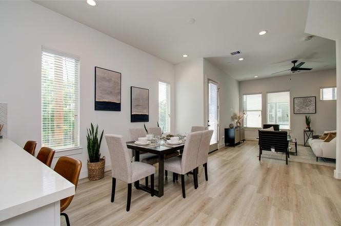 2309 Eagle Street Houston, TX 77004 - Photo 6 of 34 a view of a a dining room with furniture window and wooden floor