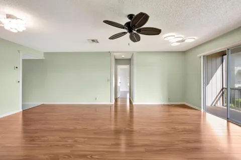 a kitchen with a stove a microwave and cabinets