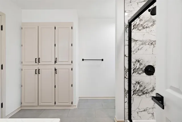 a view of a elevator with wooden floor