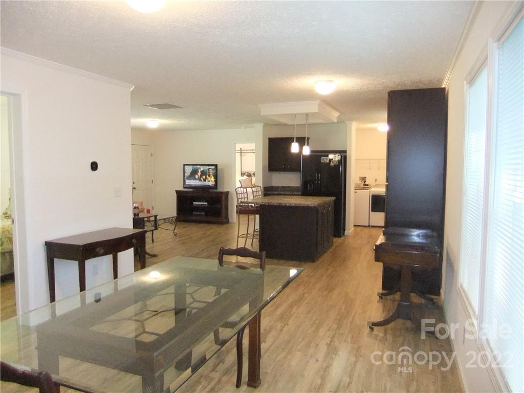292 Souther Road Fletcher, NC 28732 - Photo 13 of 33 a living room with furniture and a wooden floor