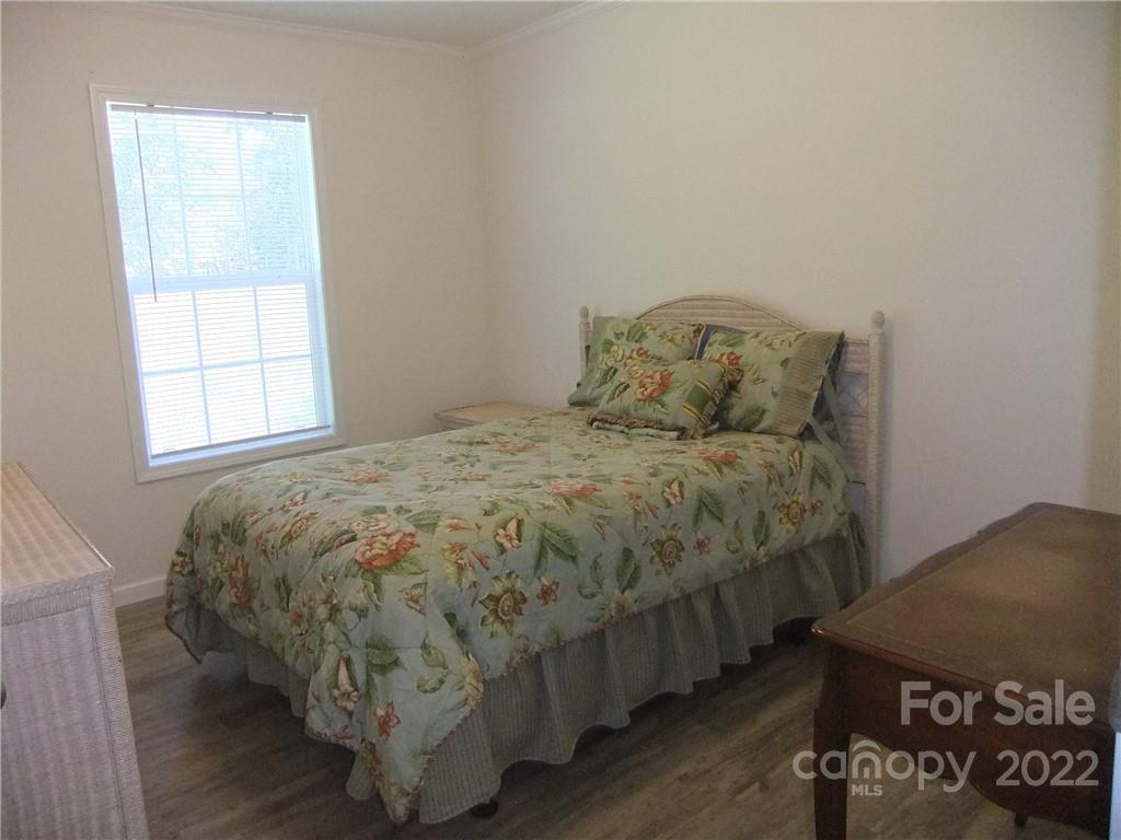 292 Souther Road Fletcher, NC 28732 - Photo 17 of 33 a bed sitting in a bedroom next to a window