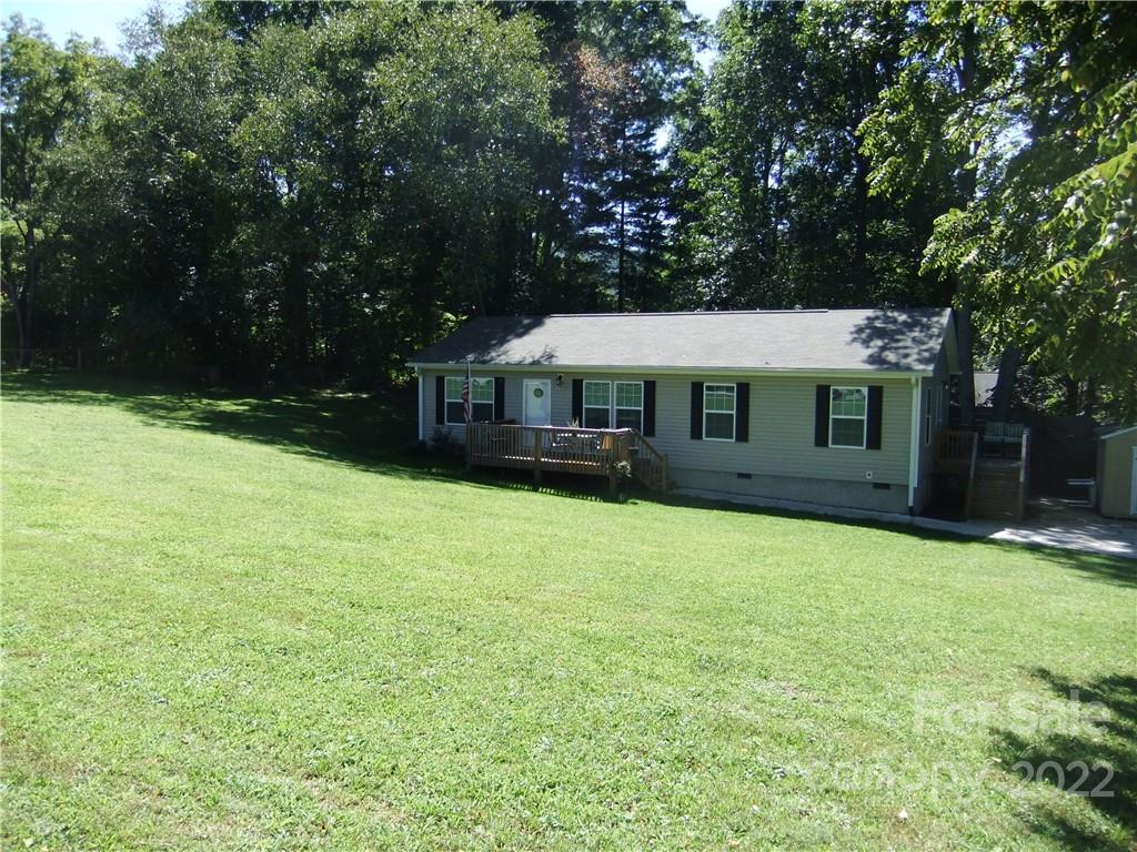292 Souther Road Fletcher, NC 28732 - Photo 3 of 33 a front view of a house with a garden