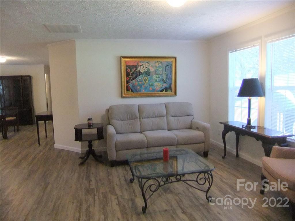 292 Souther Road Fletcher, NC 28732 - Photo 8 of 33 a living room with furniture and a wooden floor