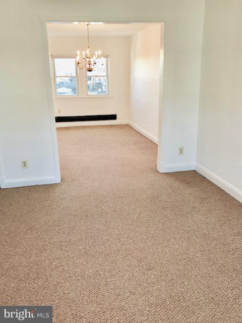 7 Warren Road Baltimore, MD 21221 - Photo 4 of 16 Living room looking into dining room