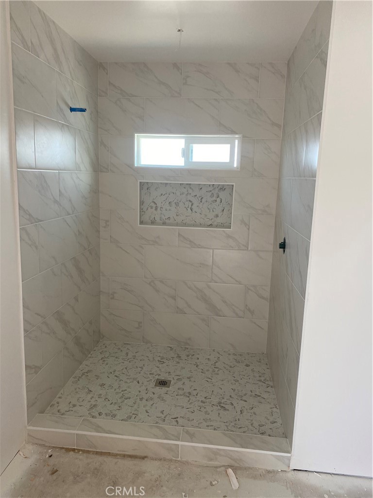 10210 Base Line Road Rancho Cucamonga, CA 91701 - Photo 11 of 13 a bathroom with a shower