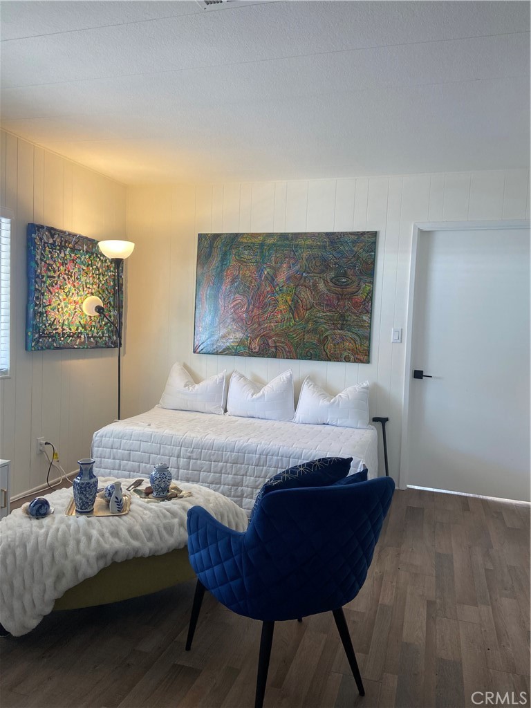 10210 Base Line Road Rancho Cucamonga, CA 91701 - Photo 4 of 13 a bedroom with a bed and wooden floor