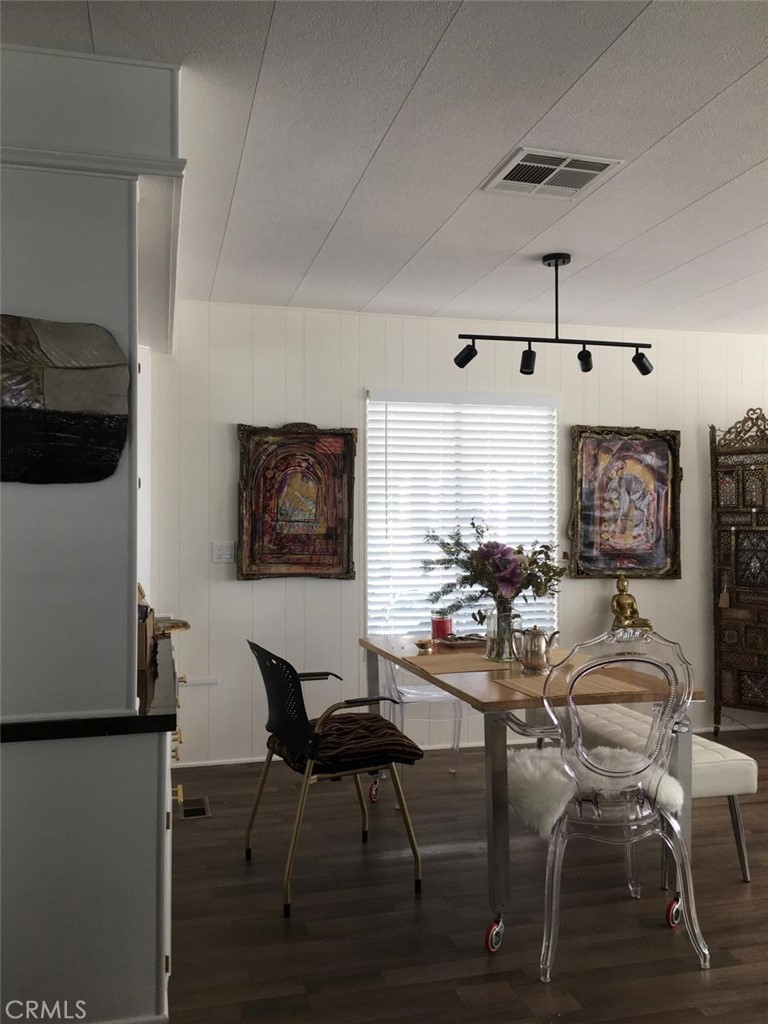 10210 Base Line Road Rancho Cucamonga, CA 91701 - Photo 10 of 13 a view of a dining room with furniture and wooden floor