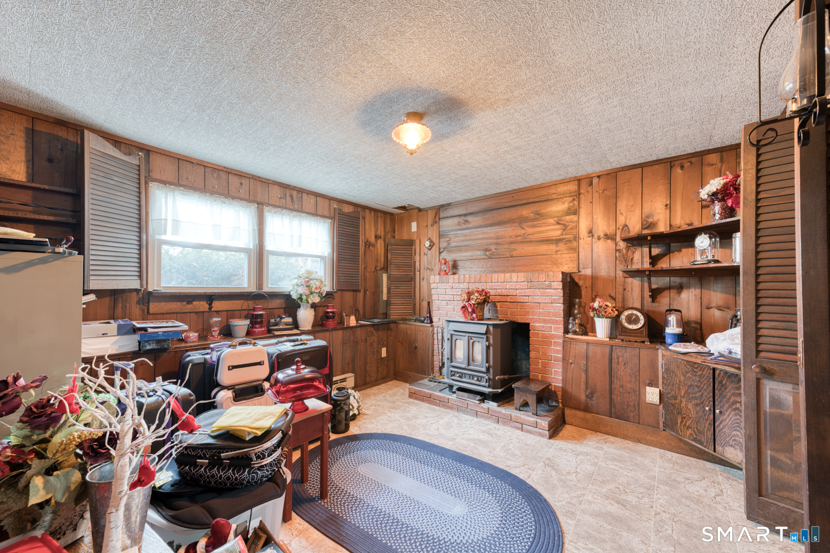 4 Arrow Drive Plymouth, CT 06786 - Photo 27 of 39 Lower level with coal/wood stove insert in Fire place.