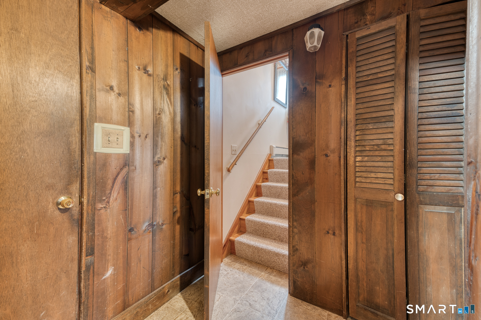 4 Arrow Drive Plymouth, CT 06786 - Photo 31 of 39 stairs from lower level family room to main level