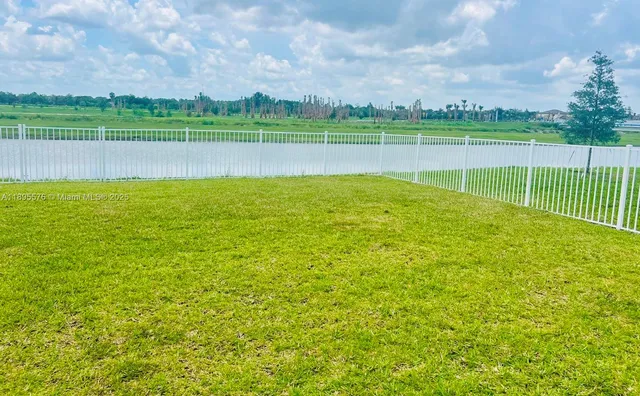 a view of a golf course with a lake