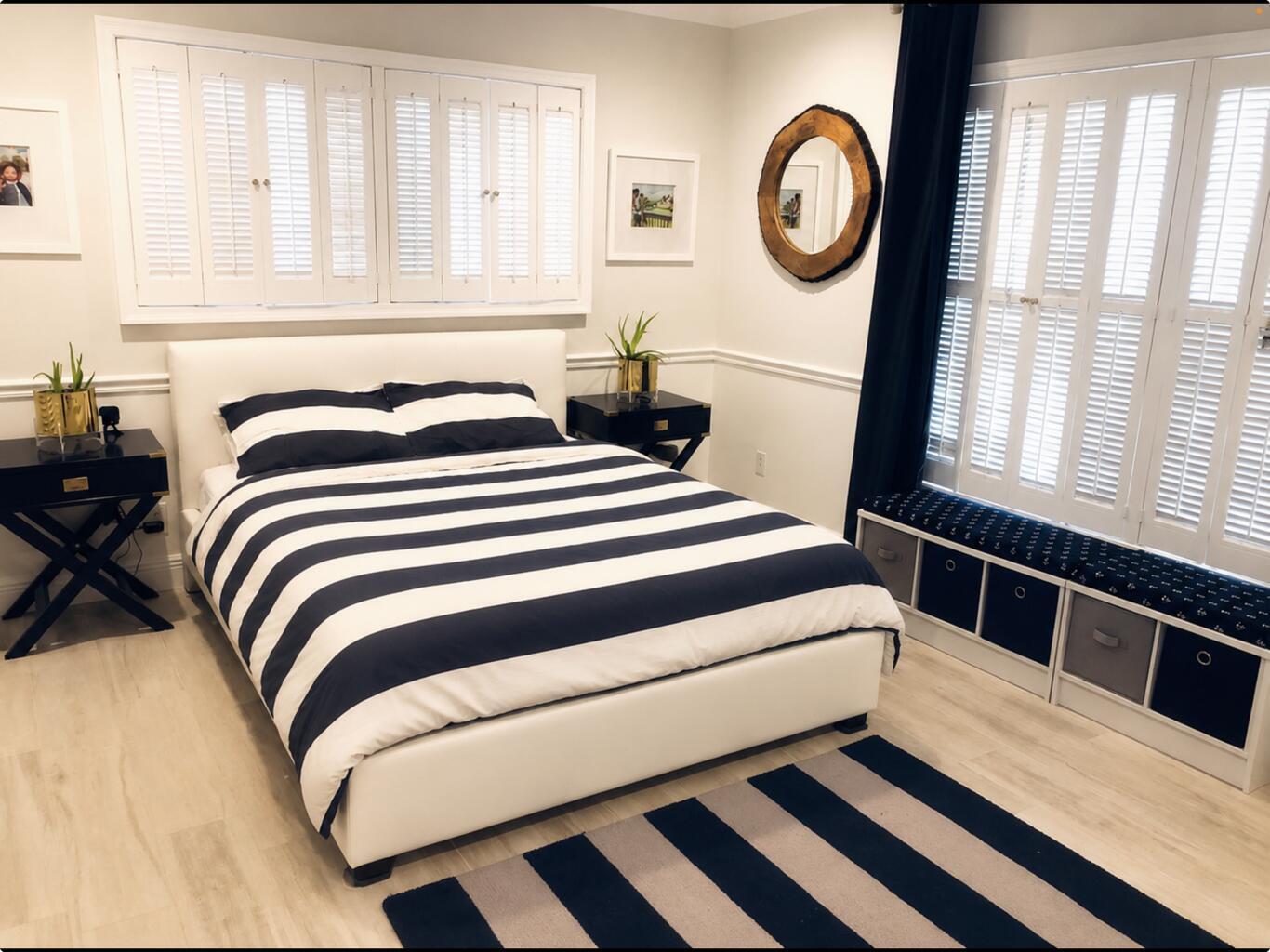 1111 Pepperridge Terrace Boca Raton, FL 33486 - Photo 6 of 8 a bedroom with a bed and a window