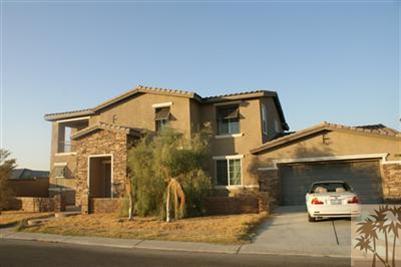 83384 Lone Star Road Indio, CA 92203 - Photo 1 of 20 a front view of a house with a yard