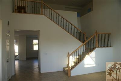 83384 Lone Star Road Indio, CA 92203 - Photo 15 of 20 a view of staircase with railing and white walls