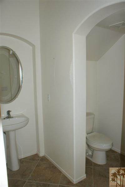 83384 Lone Star Road Indio, CA 92203 - Photo 19 of 20 a bathroom with a toilet and a sink