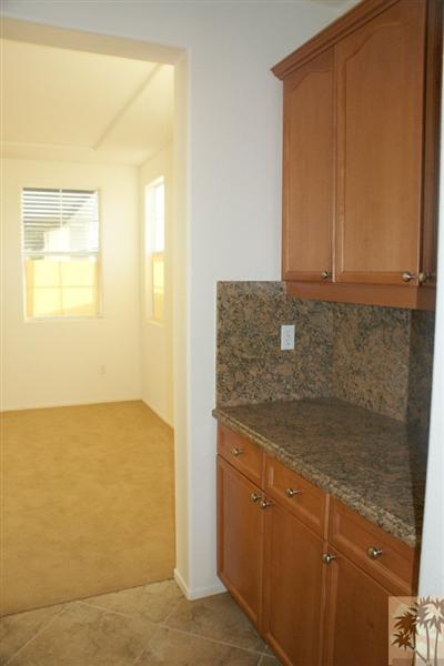 83384 Lone Star Road Indio, CA 92203 - Photo 3 of 20 a bathroom with a granite countertop sink and a mirror