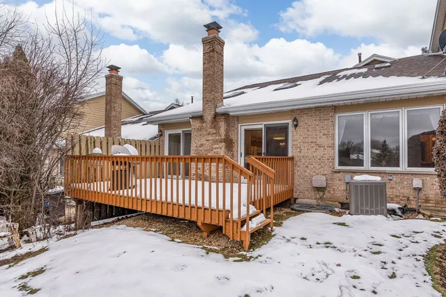 a view of a chair and tables in the patio