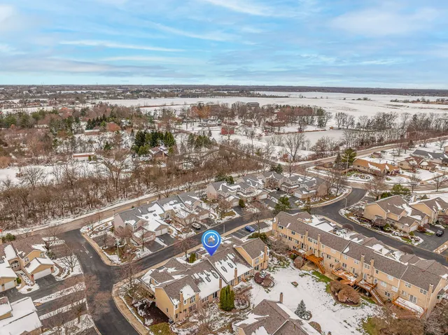 an aerial view of city and mountain