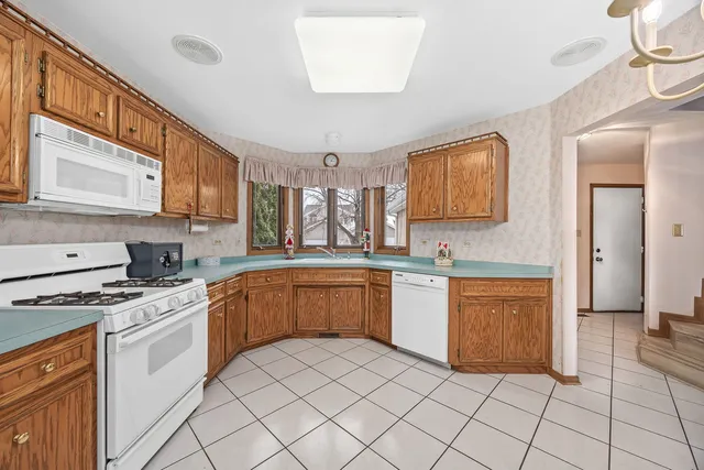 a view of an entryway with wooden floor and stairs