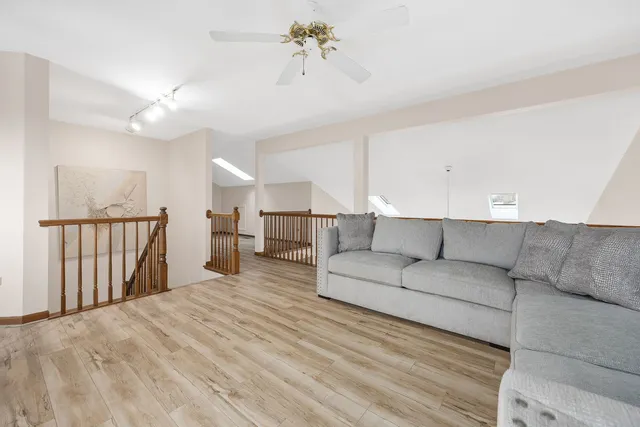 a living room with furniture and a gate