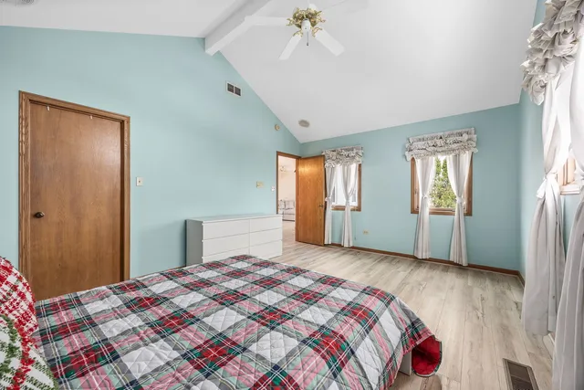 a view of a room with wooden walls