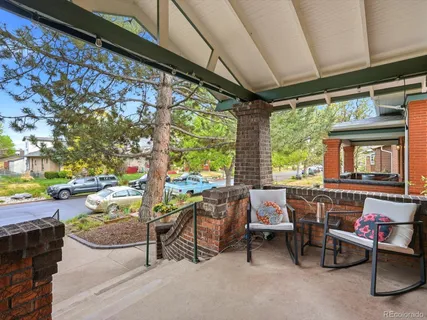 a building outdoor space with patio furniture and potted plants