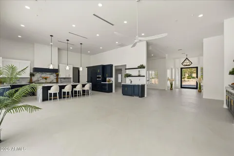 a kitchen with stainless steel appliances granite countertop a stove and a refrigerator