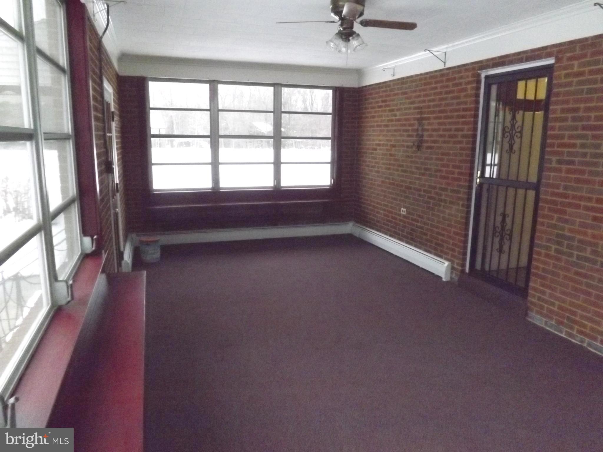 9901 Dangerfield Road Clinton, MD 20735 - Photo 14 of 39 Large enclosed and heated sun room