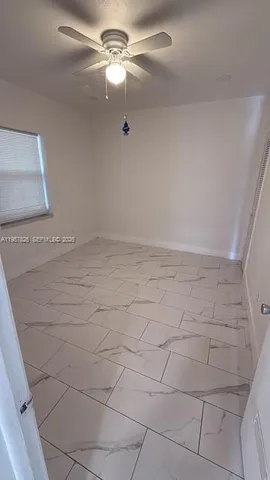 a view of empty room with fan