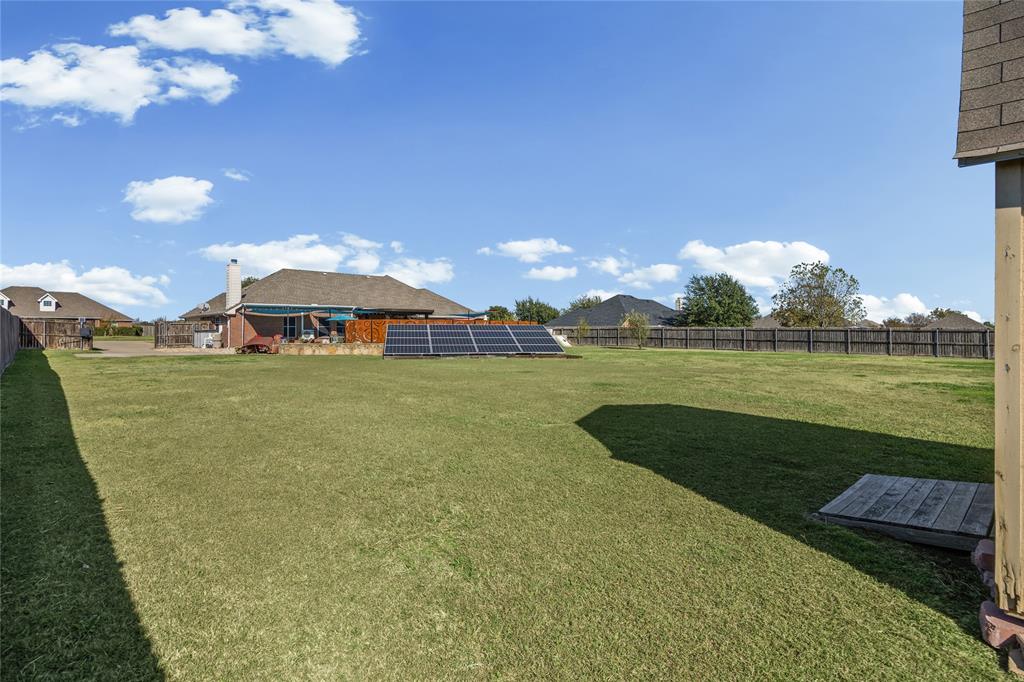 112 Springfield Lane Red Oak, TX 75165 - Photo 32 of 40 a view of a lake with a big yard
