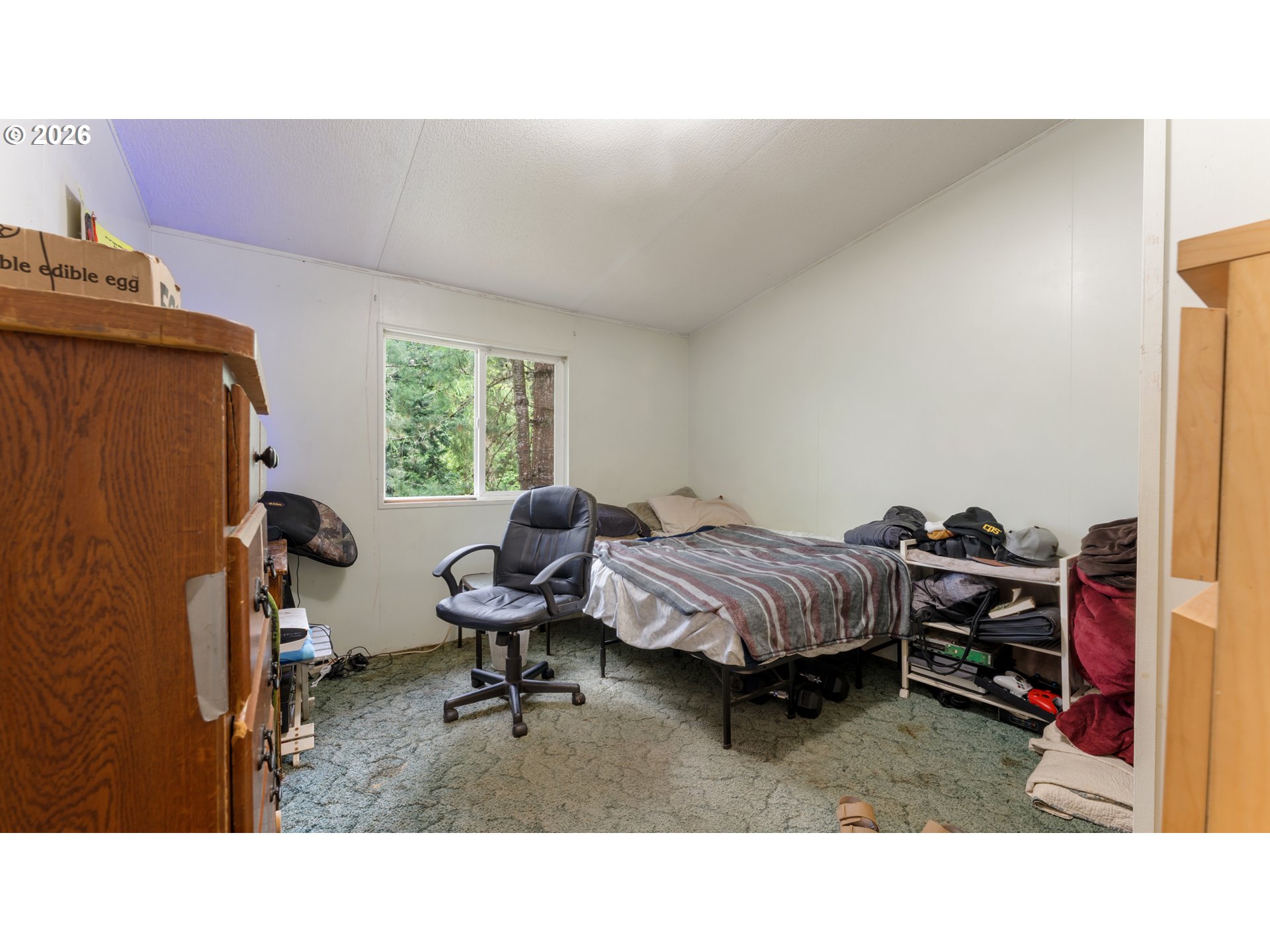 31484 Southeast Woodland Road Estacada, OR 97023 - Photo 19 of 40 a living room with furniture and a window