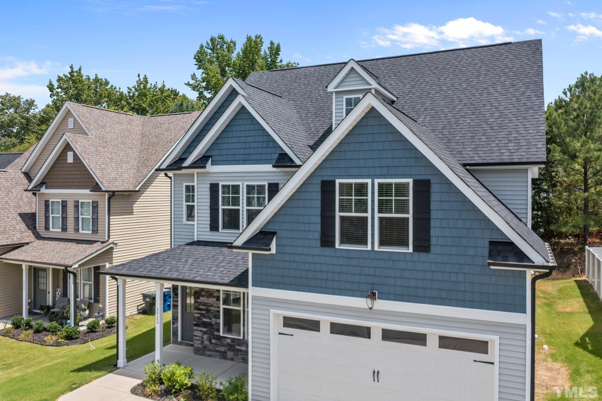 3720 Massey Ridge Court Raleigh, NC 27616 - Photo 44 of 56 a aerial view of a house with a yard and potted plants