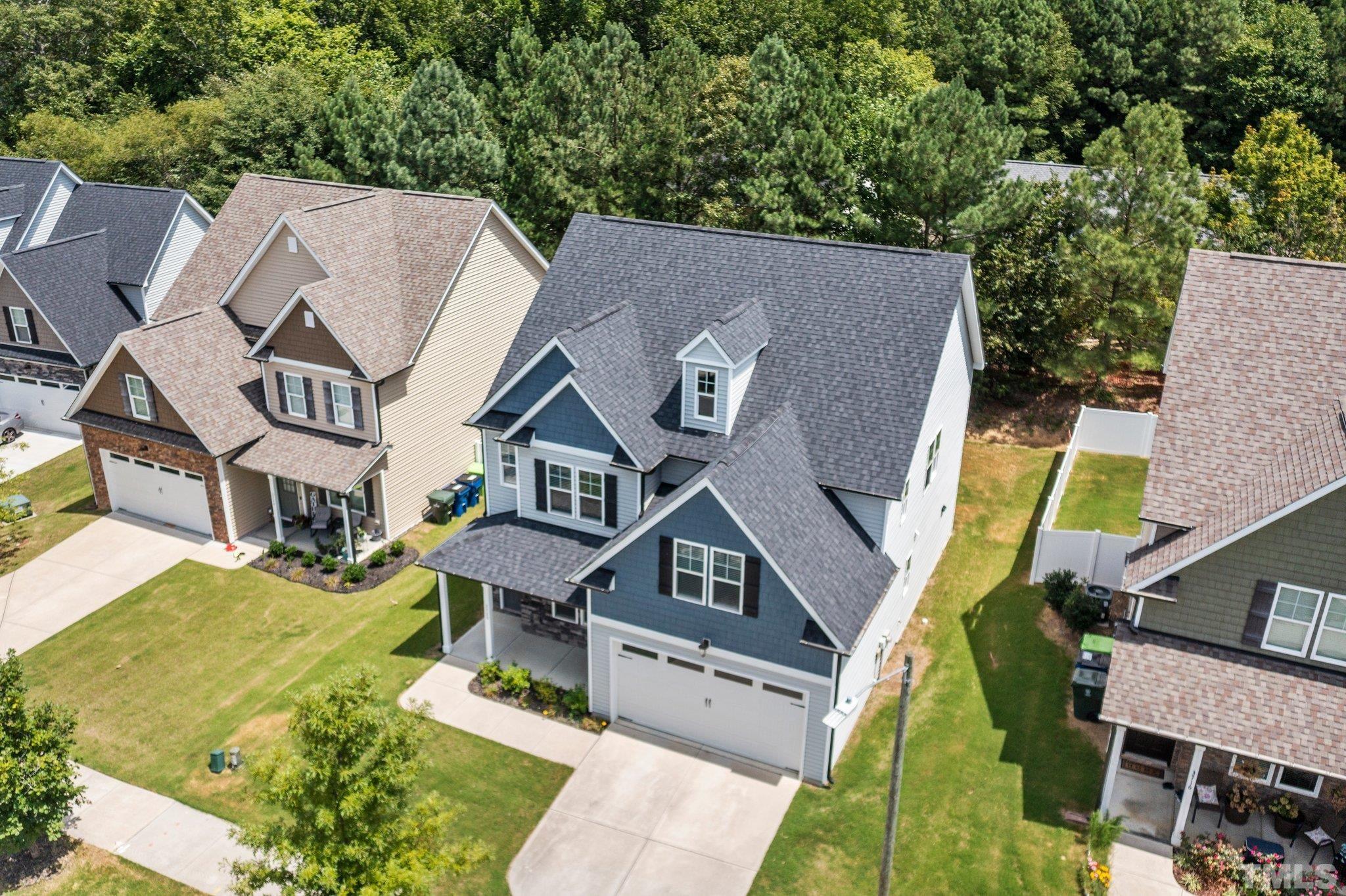 3720 Massey Ridge Court Raleigh, NC 27616 - Photo 46 of 56 an aerial view of a house with swimming pool and big yard
