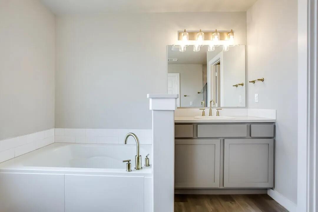 10502 Aberdeen Avenue Lubbock, TX 79424 - Photo 11 of 20 a bathroom with a sink and a mirror