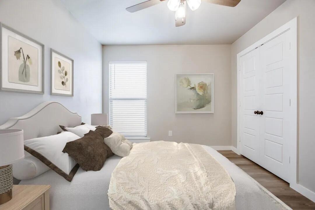 10502 Aberdeen Avenue Lubbock, TX 79424 - Photo 13 of 20 a bedroom with a bed and a chandelier