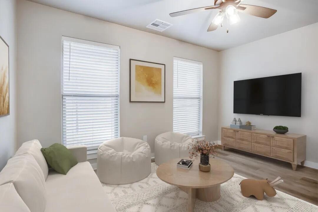 10502 Aberdeen Avenue Lubbock, TX 79424 - Photo 15 of 20 a living room with furniture and a flat screen tv
