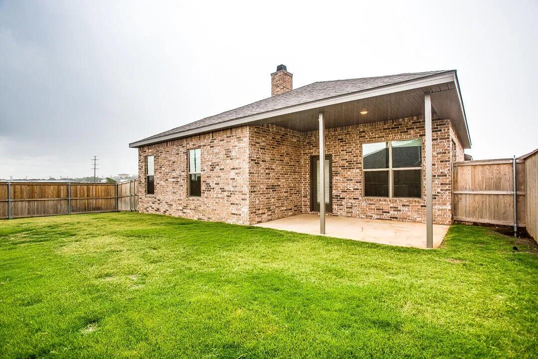 10502 Aberdeen Avenue Lubbock, TX 79424 - Photo 20 of 20 a view of a house with backyard and porch