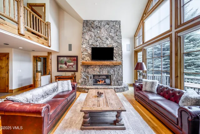 a spacious bedroom with a large bed and a large window