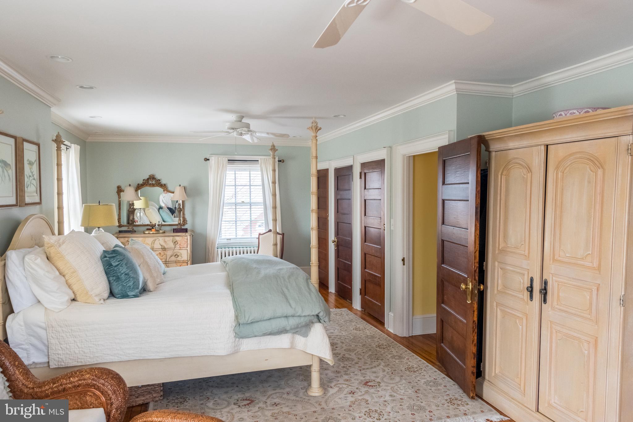 4250 Township Line Road Newtown, PA 18940 - Photo 22 of 61 a bedroom with a large bed and a couch