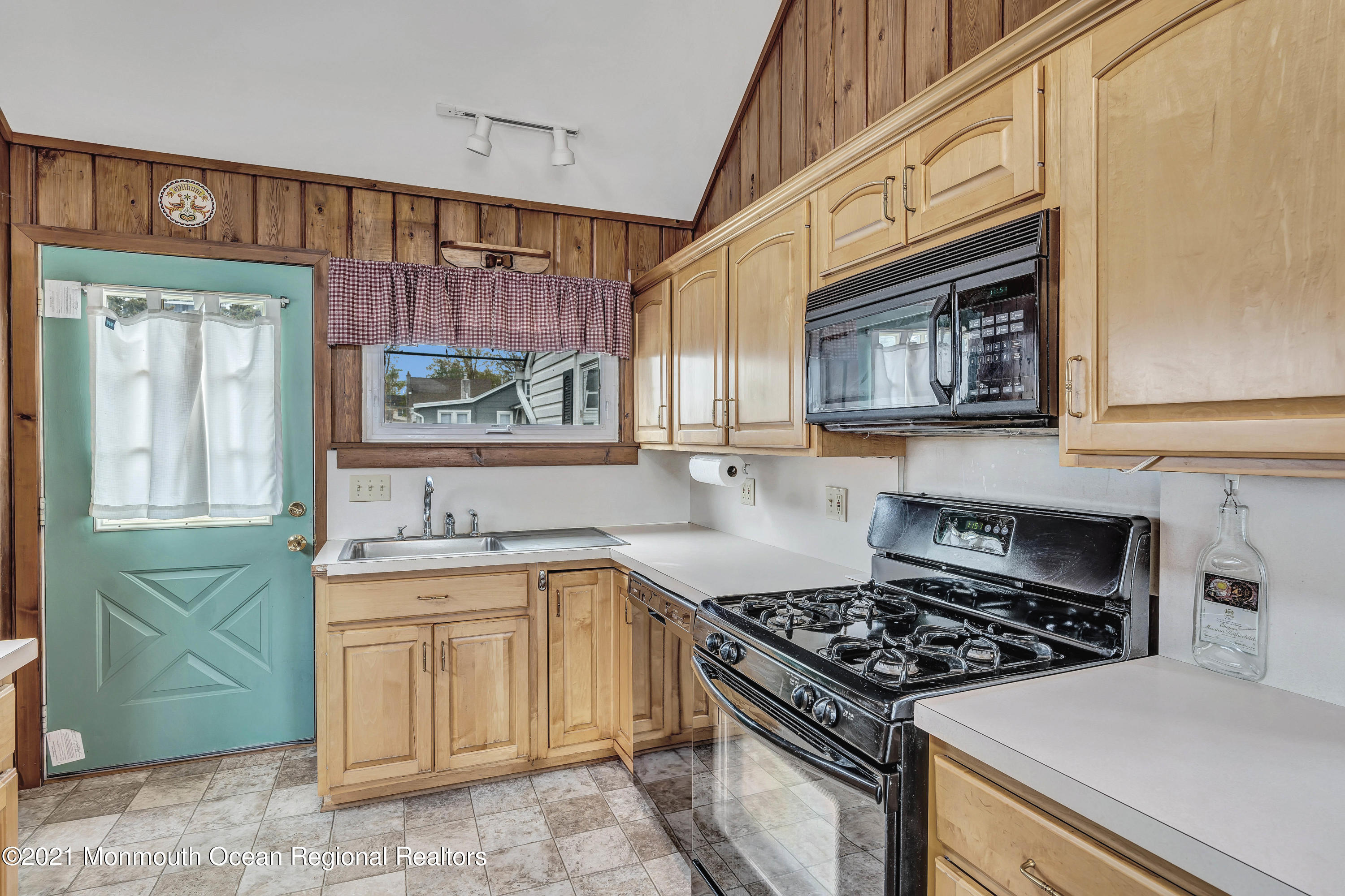 65 Metedeconk Road Brick, NJ 08723 - Photo 21 of 67 a kitchen with a stove and a sink