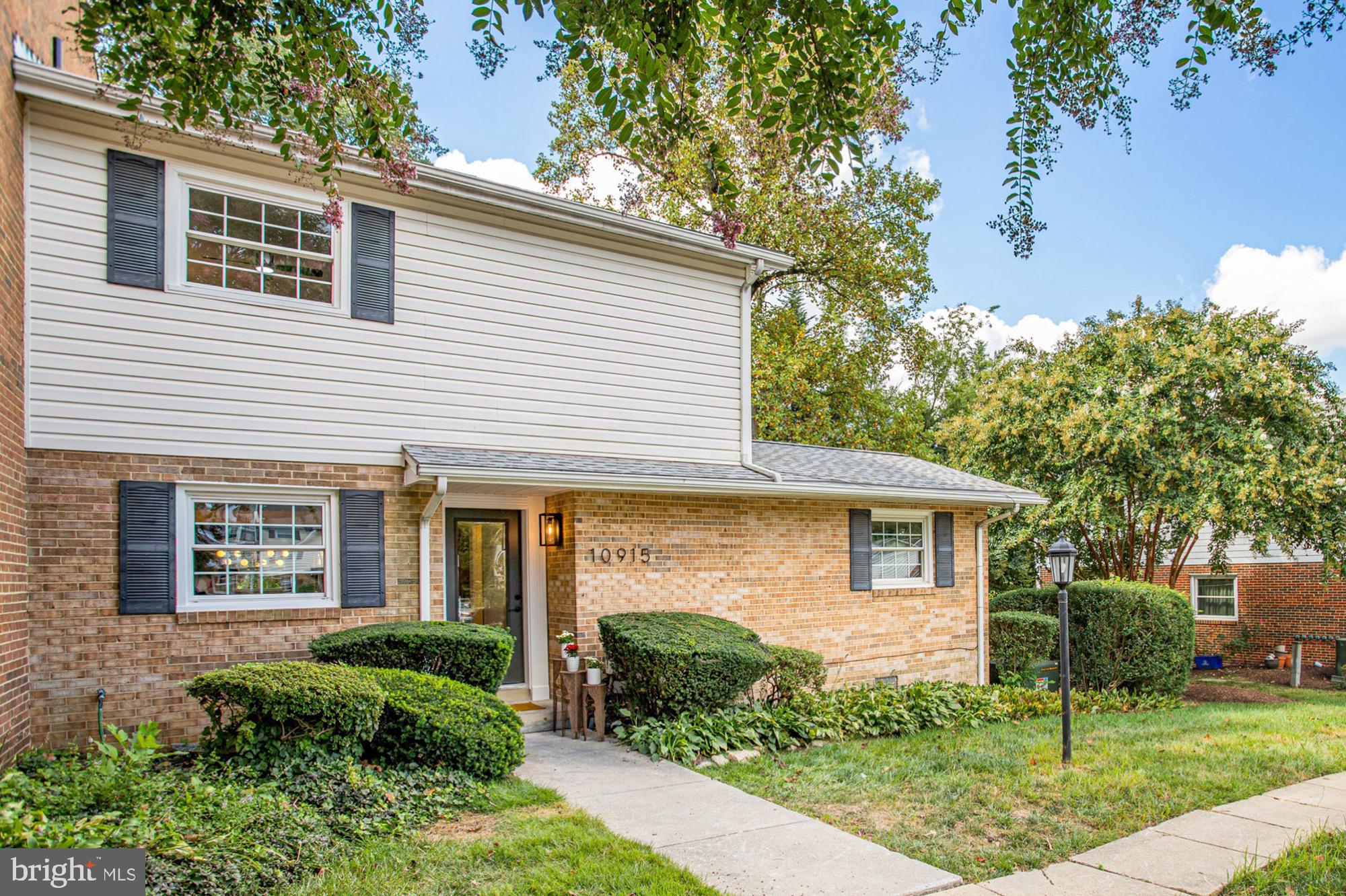 10915 Bucknell Drive, Unit 82 Silver Spring, MD 20902 - Photo 2 of 10 a view of a house with a yard