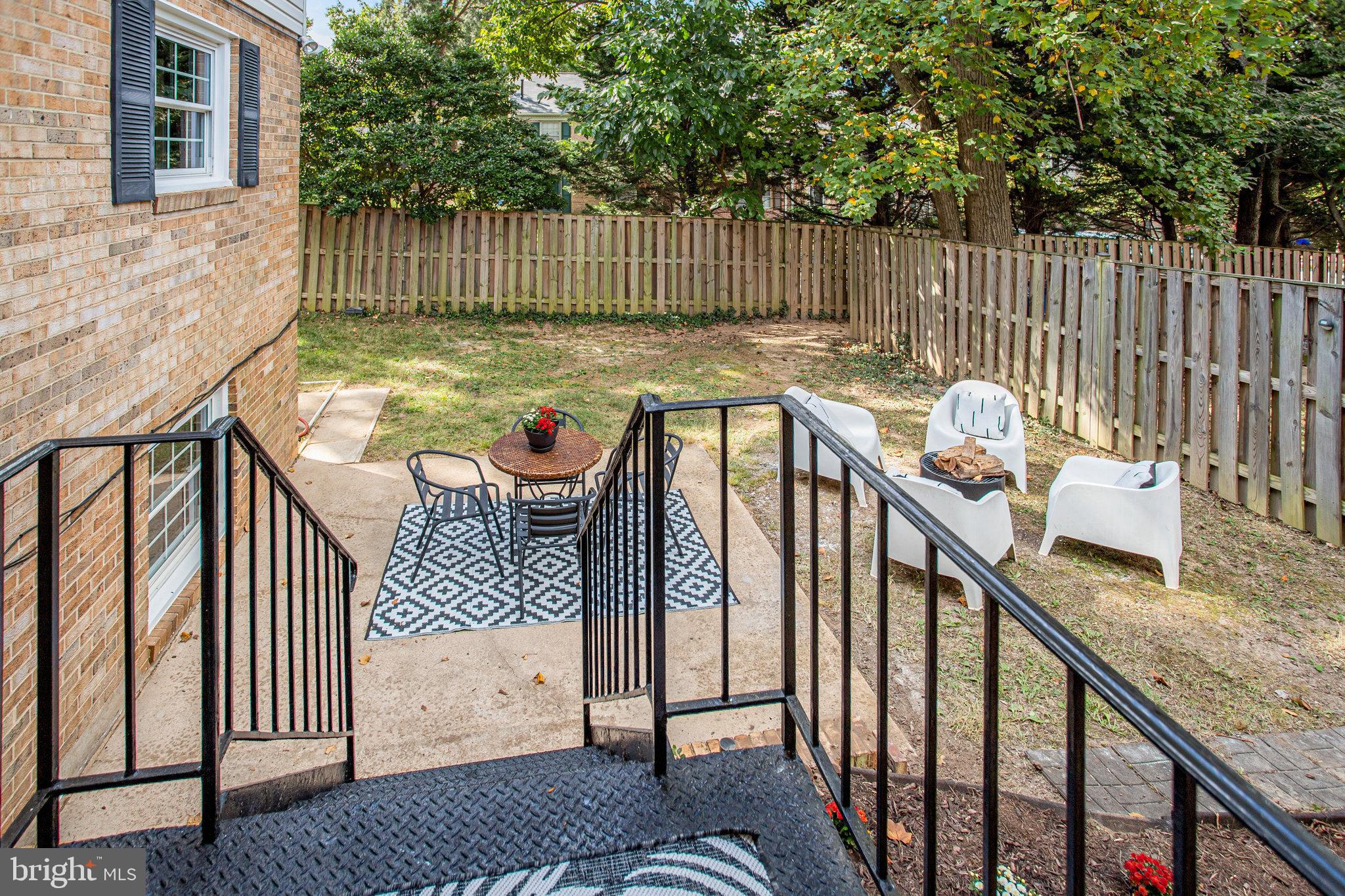 10915 Bucknell Drive, Unit 82 Silver Spring, MD 20902 - Photo 3 of 10 a view of deck with furniture and wooden fence