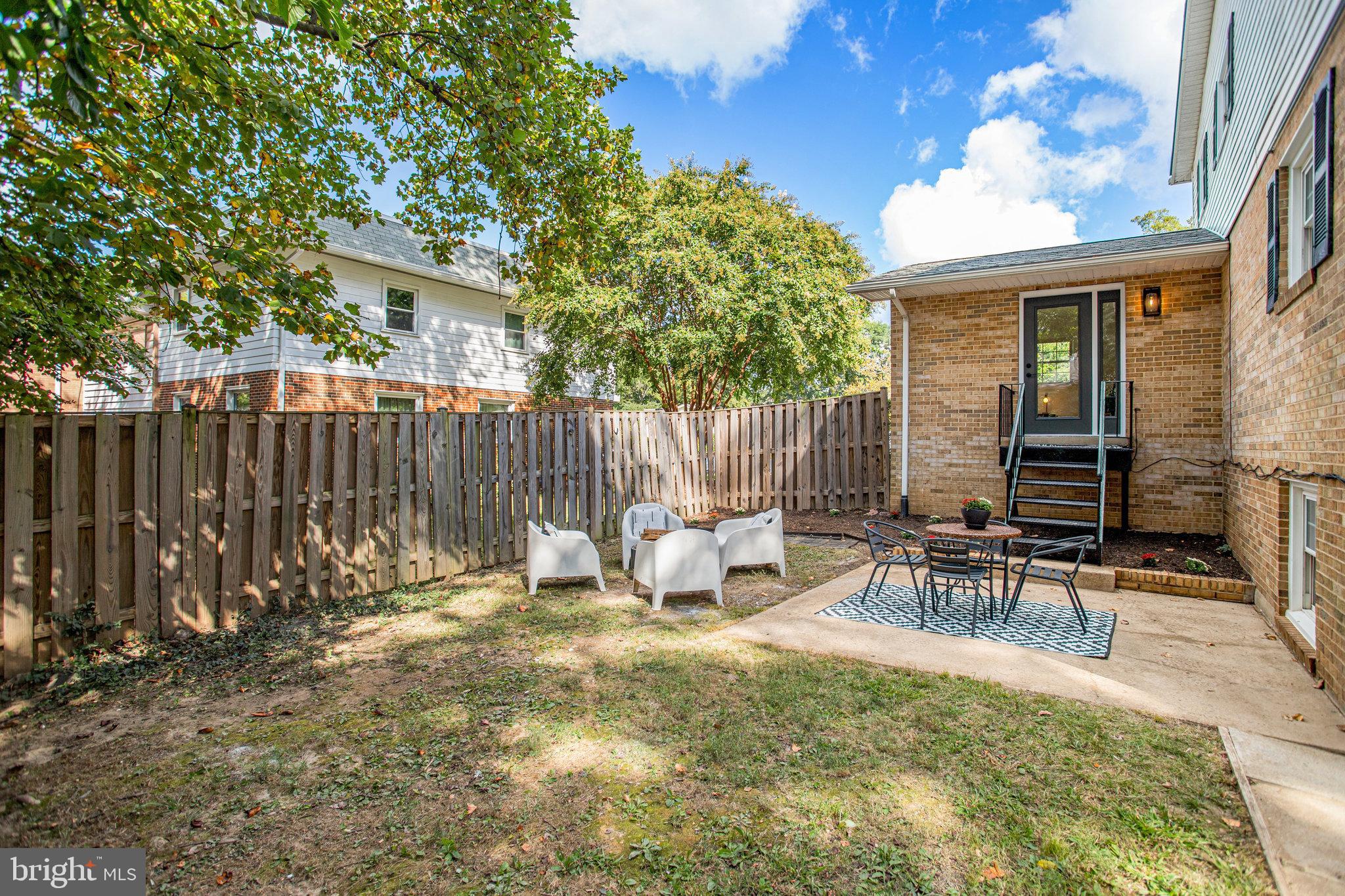 10915 Bucknell Drive, Unit 82 Silver Spring, MD 20902 - Photo 4 of 10 a view of outdoor space with seating area and trees around