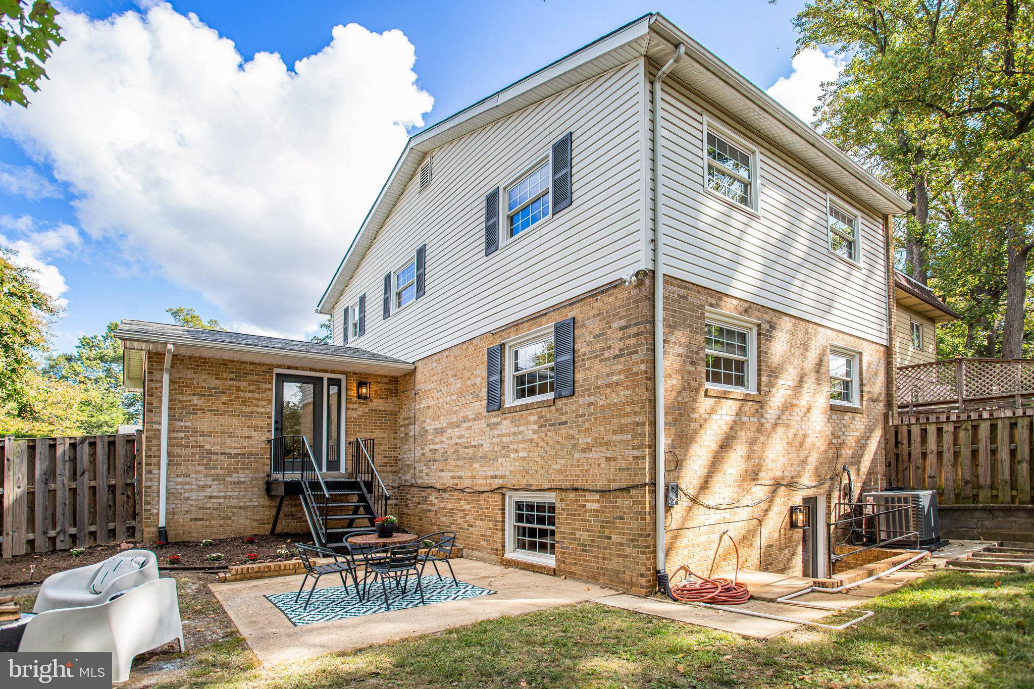 10915 Bucknell Drive, Unit 82 Silver Spring, MD 20902 - Photo 6 of 10 a view of a house with a yard