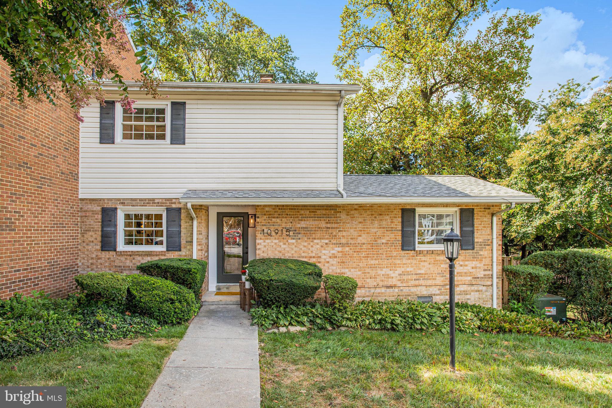 10915 Bucknell Drive, Unit 82 Silver Spring, MD 20902 - Photo 7 of 10 a view of a house with a yard