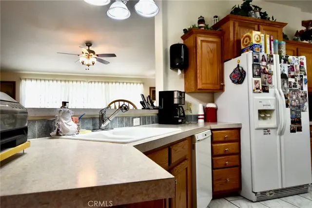 a kitchen with stainless steel appliances a sink a stove and a refrigerator